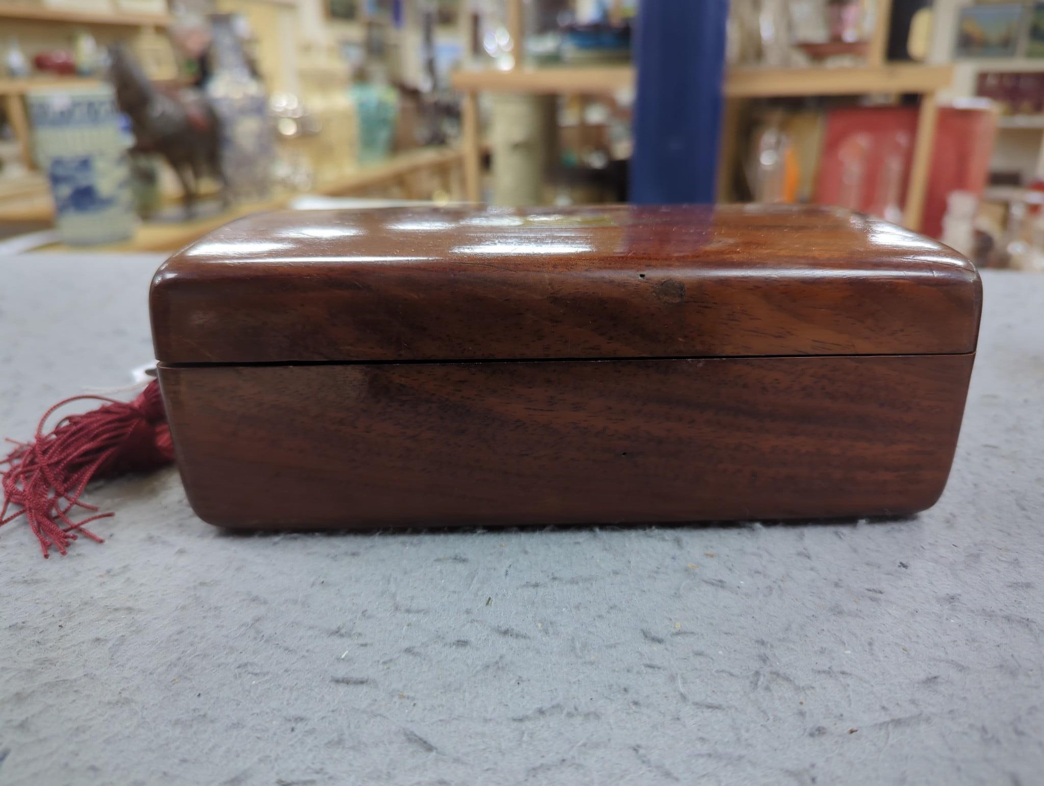 A 19th century Dutch amboyna and brass mounted tea caddy, 14 cm wide and a 19th century French mahogany box by Aucoc Aine a Paris